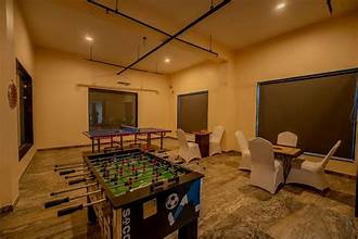 Indoor games room with foosball and table tennis at Amrutham Bagh